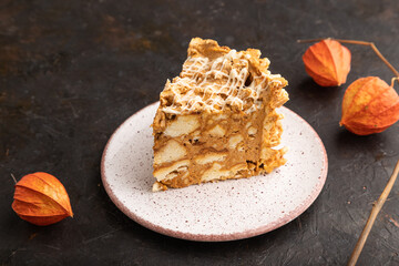 Traditional lithuanian cake shakotis on black, side view, close up.