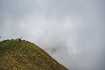 Chiangmai.thailand 19.11.2022  unacquainted people hiking on monjong mountain with mist cover the mountain.Doi Mon Jong is one of the top ten peaks in Thailand.