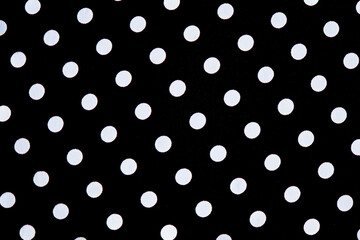 Black fabric in a white circle. Fabric texture. Up close