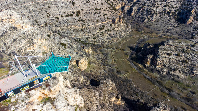 Aerial drone view of Ulubey Canyon from the glass terrace. Ulubey Canyon is the second longest canyon in the world. Ulubey, Usak, Turkey. Turkish name; Ulubey Kanyonu Cam Teras