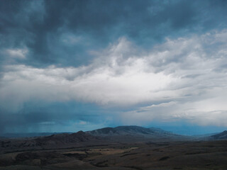 Storm forming over the mountain hill