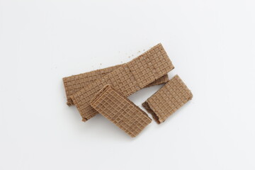 a close up of chocolate wafers isolated on white background.