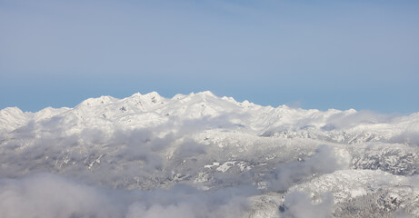 Snow and Cloud covered Canadian Nature Landscape Background. Winter Season in Whistler, British Columbia, Canada. From Blackcomb Mountain