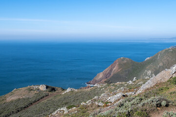 Shoreline at  Sausalito's Marin Headlands recreation area on a mostly sunny day with lots of copy space- long exposure