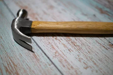 Foto op Plexiglas hammer and  on wood table © reznik_val