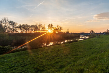 Sunrise with Olse river and sunlights in Karvina city in Czech republic