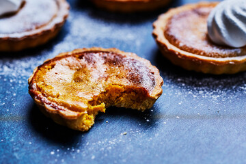 Custard tart with bite taken out 