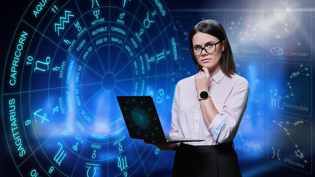 Young woman with laptop looking at camera, astrological symbols and signs background.