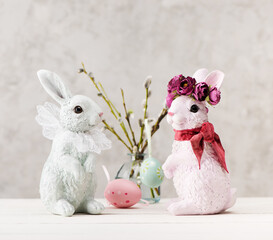 Festive composition with Easter eggs, willow branches and Easter bunny