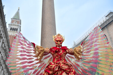 Person dressed up for Carnival of Venice wearing Fenix costume