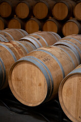 Rows of french and american oak barrels in cellars of winery in Rioja wine making region, Spain