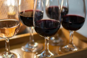 Fotobehang Tasting of rioja wines, visit of winery cellars with french or american oak barrels with agening red wine, Rioja wine making region, Spain © barmalini