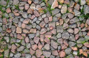 
the road is strewn with rubble. background of fine granite stone