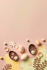 Obraz premium Pastel Easter eggs on warm pink background top view