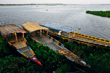 Colourful Boats during Rainy season in Bangladesh. These Traditional Boats can be found in "Haor" area of Bangladesh,while the water level rises during Monsoon time.