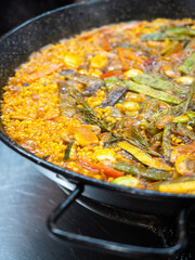 Close-up view of vegetarian paella. Traditional Spanish regional cuisine, Valencia.