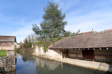 Fototapeta premium Orvanne river in Flagy village. Ile de France region