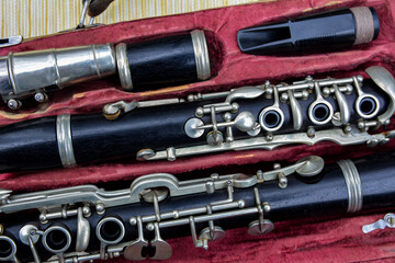 Disassembled clarinet in its case .