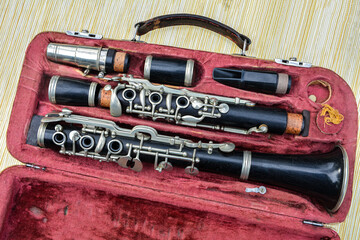 Disassembled clarinet in its case .