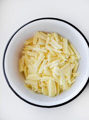 Sliced potatoes in a saucepan. Fresh potatoes.