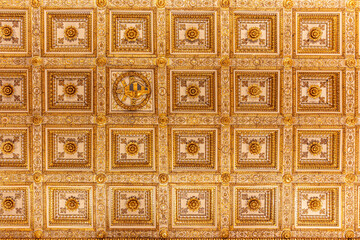 Golden floral decoration from the ceiling in the Patriarchal Basilica of St. Mary Major. Rome, Italy