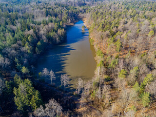 Aerial view of a lake in the middle of a forest