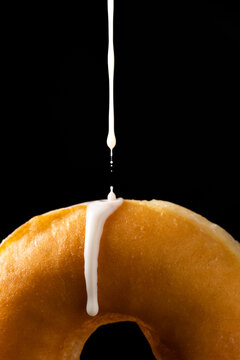 Delicious doughnut poured with sugar icing