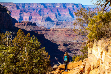 hiker girl descends into the interior of the grand canyon, exhaustive hacking in grand canyon national park with incredible views 