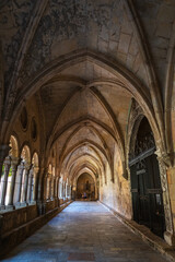 Fototapeta na wymiar Cloister of the Cathedral of Tarragona, a Roman Catholic Church built in early-12th-century in Romanesque architectural style.