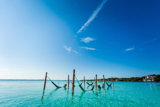 Woman on hammock in Bacalar lagoon Mexico