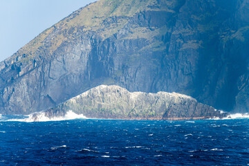 Rocky cliffs give place for flocks of seabirds at Cape Horn on Hornos Island in Chile