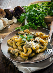 Homemade pasta with artichoke sauce on the plate