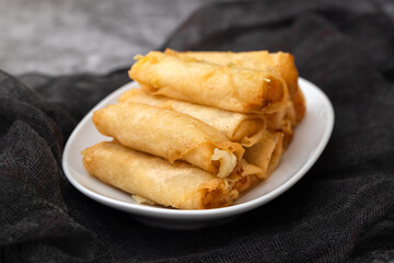 Spring Roll also known as Egg Roll on white dish