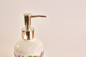 Fototapeta na wymiar Ceramic bottle with liquid soap. Washing hands. Hygiene concept.