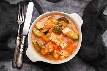 Delicious stew squid with vegetables in bowl