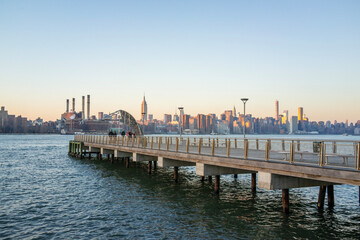 Panorama of a Pier and New York City Skyline Background at Sunset