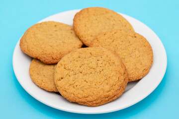 Few homemade cookies on white small dish