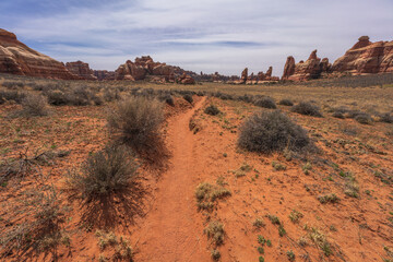 hiking the chesler park loop trail in the needles in canyonlands national park, usa