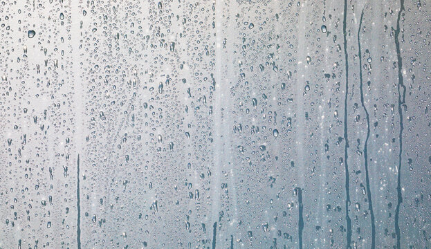 water drops on a window or in the shower cabin,wet transparent panorama background