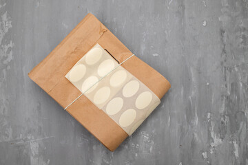 brown paper bag with paper clip on ceramic
