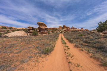 hiking the chesler park loop trail in the needles in canyonlands national park, usa