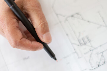 Architect, Engineer, drawing up plumbing and drainage blueprints