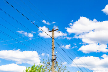 Power electric pole with line wire on colored background close up