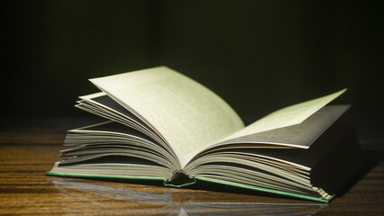 open old book on wooden table