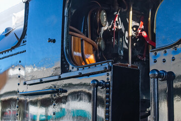 Vintage Steam engine 4277 train waiting at the station. A beautifully maintained engine with black shiny paintwork gleaming. 