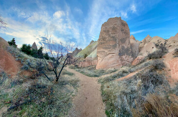 rock formation landscape inside the red valley in Cappadocia, Nevsehir, Turkiye, bluetimes sunset 
