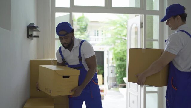 Team of employee workers with a truck car moving house for customers, delivering boxes with uniform.Vehicle transportation. Shipping and packaging business occupation service company. People lifestyle