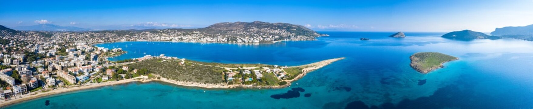 Aerial bird's eye photo taken with drone of famous bay and port of Porto Rafti with turquoise clear waters, Mesogeia, Attica, Greece.