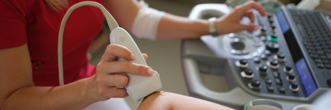 Doctor medical examination of ultrasound of elbow