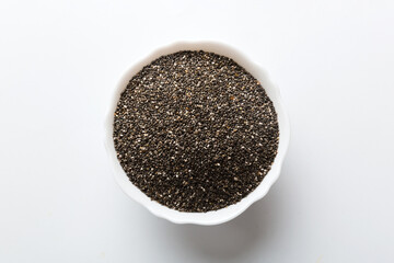 Chia seeds in bowl on colored background. Healthy Salvia hispanica in small bowl. Healthy superfood